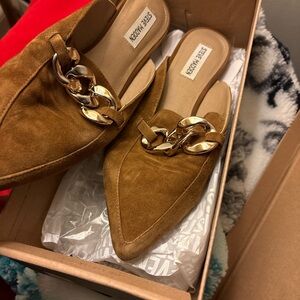 Steve Madden slip on shoes with buckle.